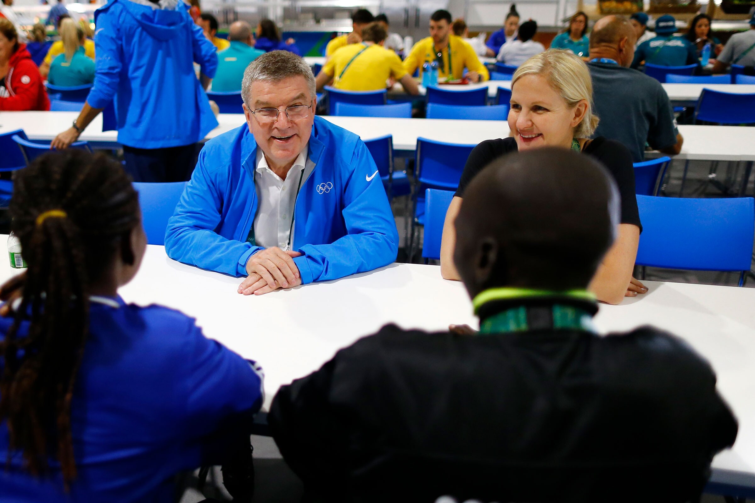 IOC President Thomas Bach, IOC member Kirsty Coventry meet with two athletes in the Olympic village in Rio de Janeiro, Brazil.