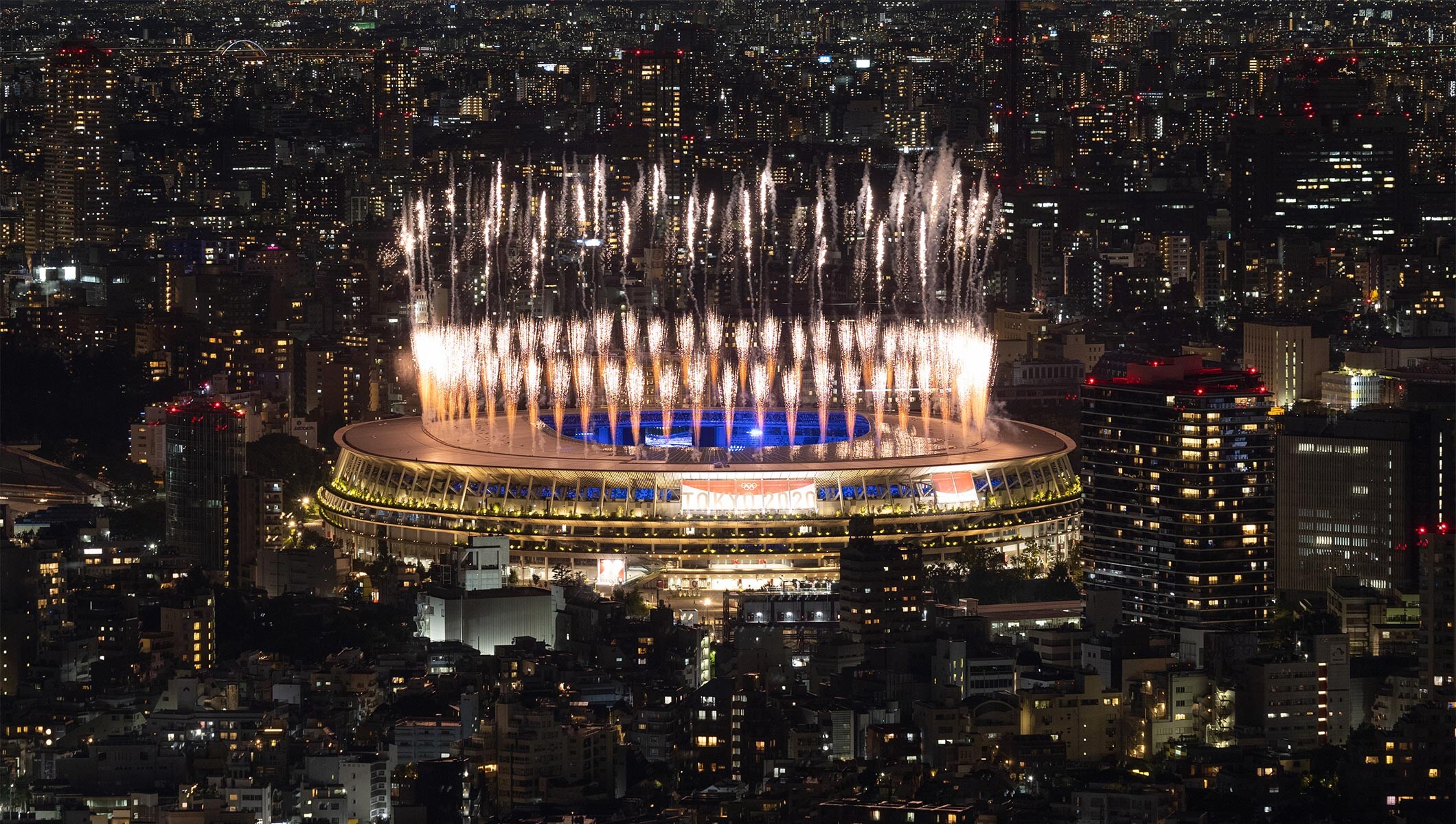 Fireworks erupt above the stadium during the Closing Ceremony of the Tokyo 2020 Olympic Games at Olympic Stadium