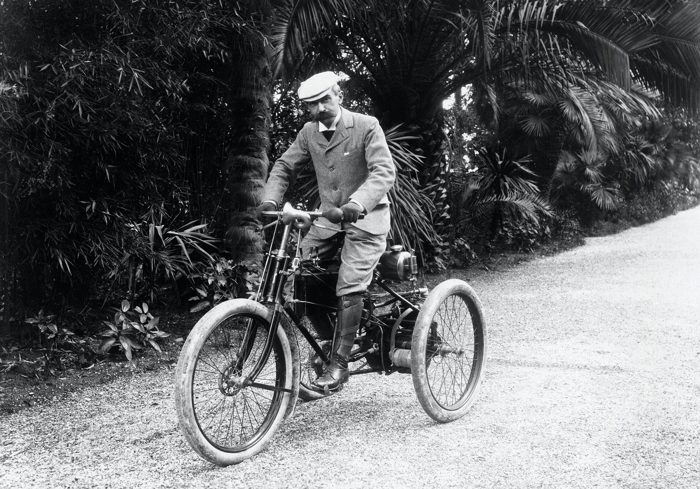 Baron Pierre de COUBERTIN on a motor tricycle in the south of France.