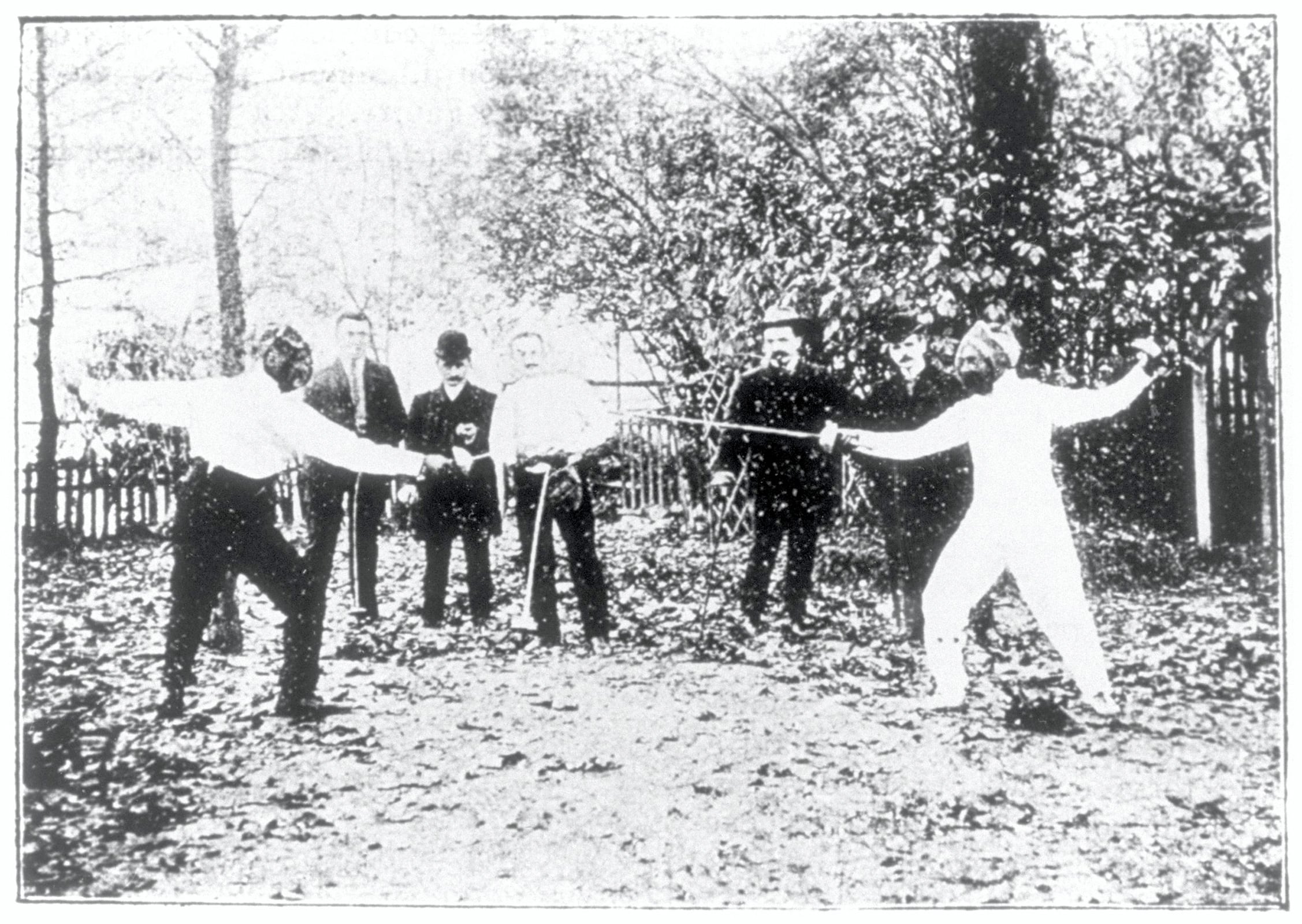  Baron Pierre de COUBERTIN against Mr. VIENNE at the School of Utilitarian Sports. Pr DUBOIS in the middle.